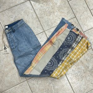 Flare denim with plaid patchwork. Very cute jeans. Runs small.